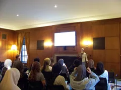 A speaker addressing ISA members in a lecture room