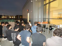 ISA members gathered on an outdoor terrace at dusk