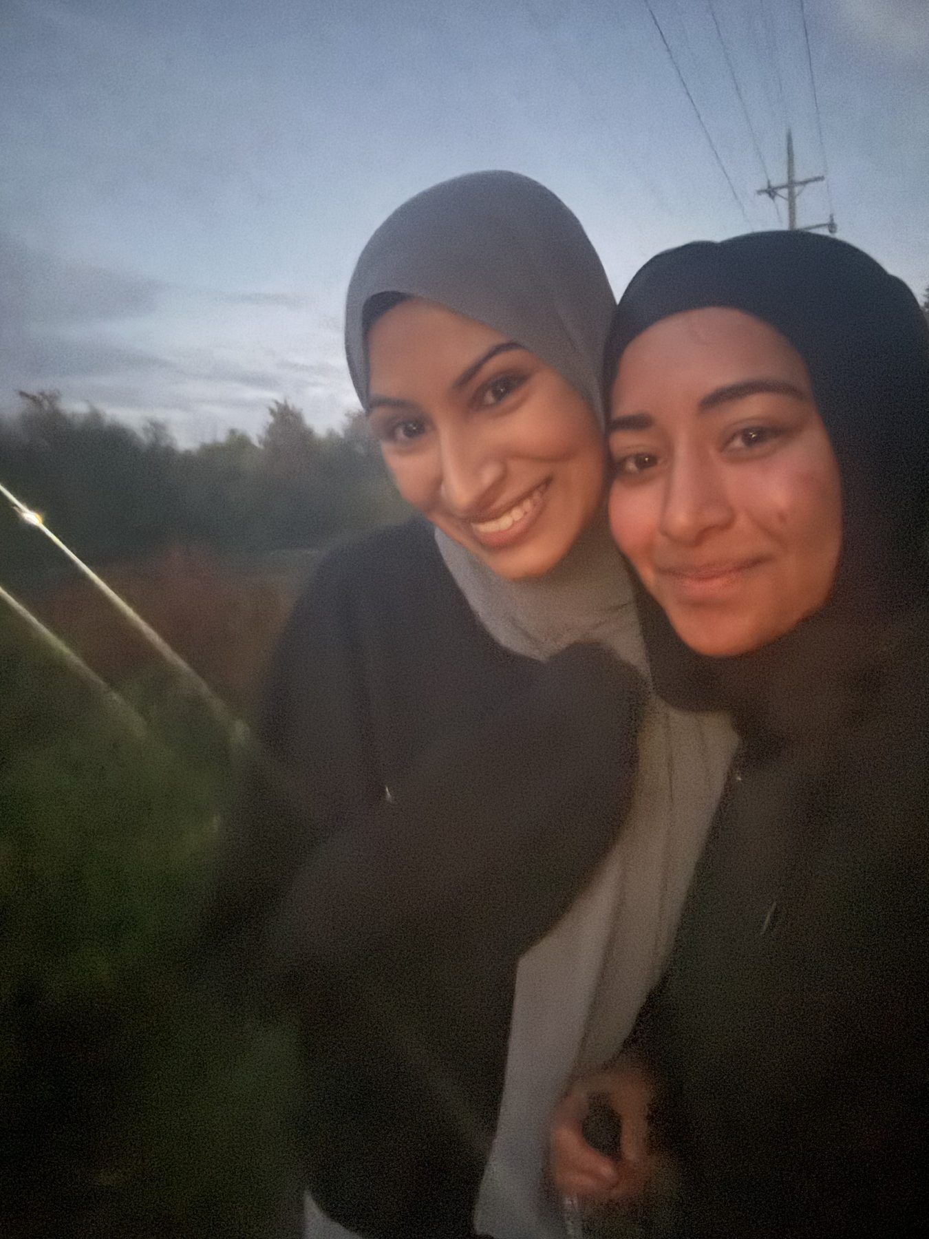Two ISA members taking a selfie outdoors