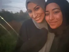 Two ISA members taking a selfie outdoors