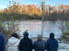 ISA members by a river on an autumn walk